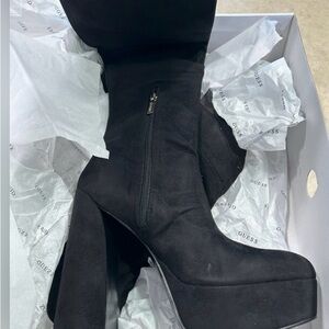 Guess Women's Black platform thigh high boots size 10